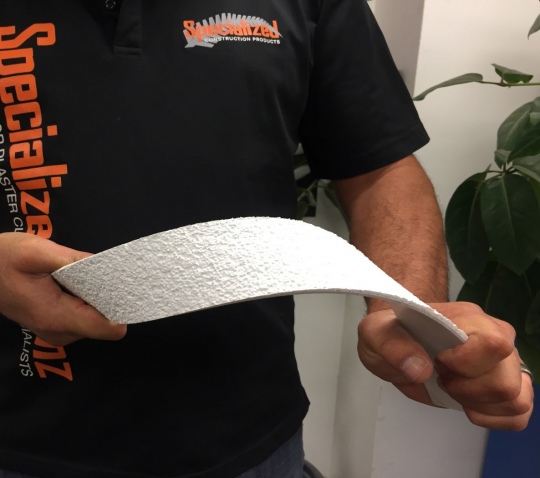 Specialized employee holding the Powaflex Acrylic Plaster System